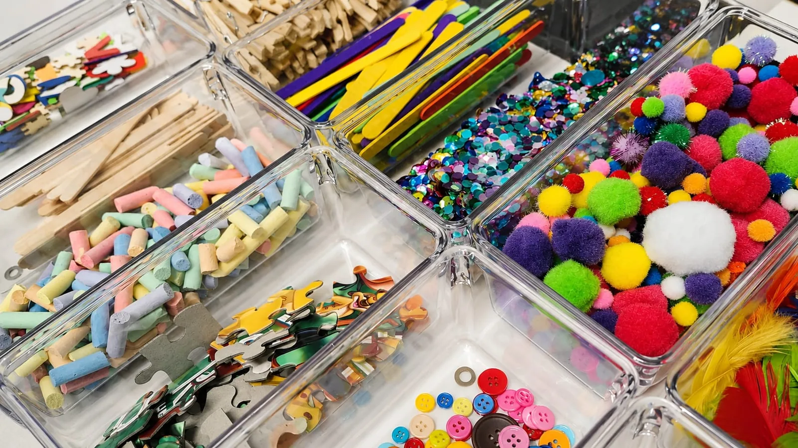 Colourful art materials arranged in trays at Enso Art Therapy